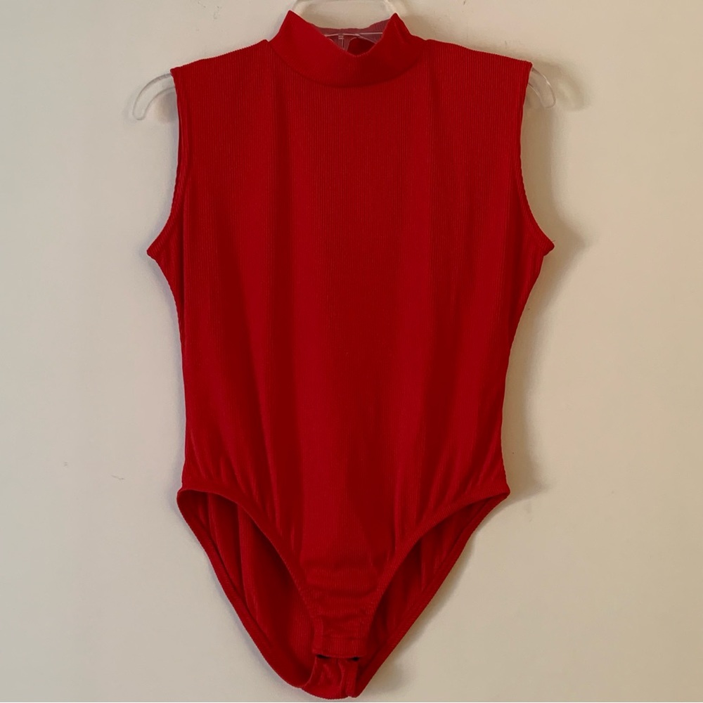JONDEN. Red sleeveless bodysuit. Buttons on bottom. Turtle neck. Button …